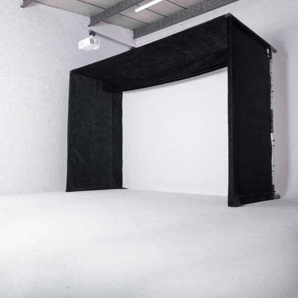 Black golf simulator enclosure with impact screen and projector for indoor practice