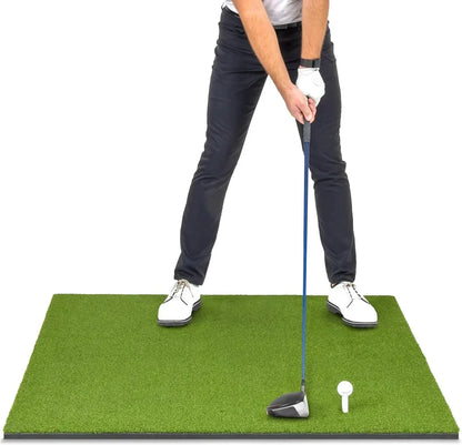 Golfer practicing swing on indoor golf mat with club and ball, ideal for home simulator setups.