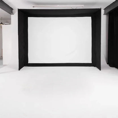 Indoor golf simulator impact screen with black enclosure for home or commercial use
